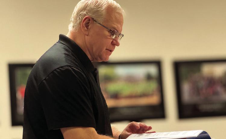 Auditor Mike Edgin of Edgin, Parkman, Fleming &amp; Fleming, PC, reviews Aspermont ISD’s 2024–25 financial report during the district’s November meeting, highlighting strong reserves and improved year-end performance. PHOTO BY JEFF HURT