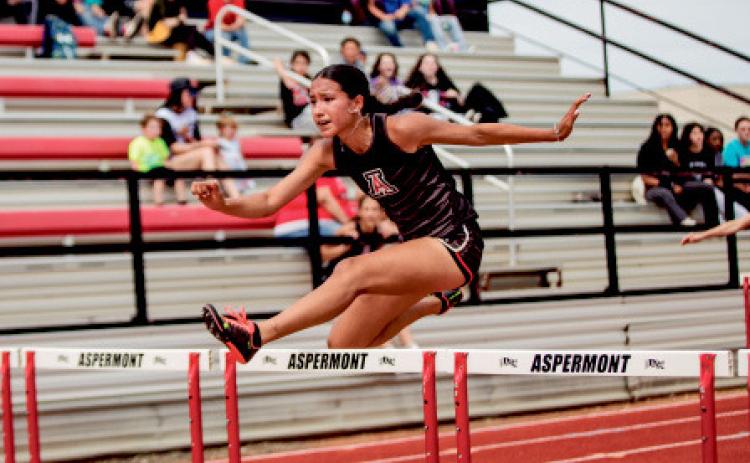 Aspermont’s Emilee Silva running the 100m Hurdles.