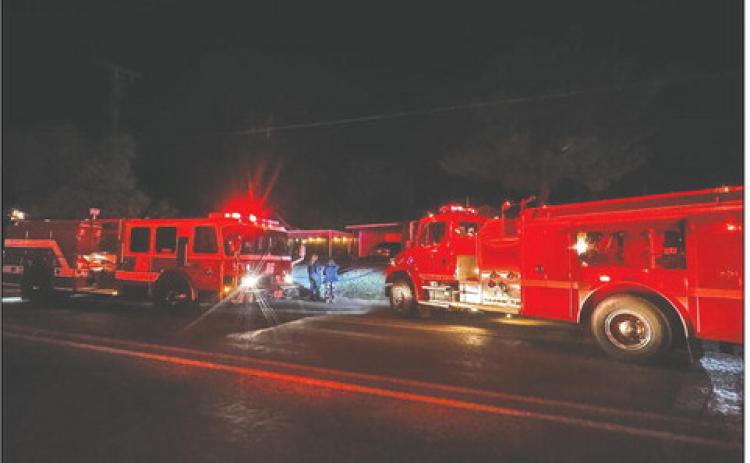 Volunteer firefighters from Rotan and Roby departments respond to a residential blaze on North Cleveland Avenue, containing the fire before the home was lost.