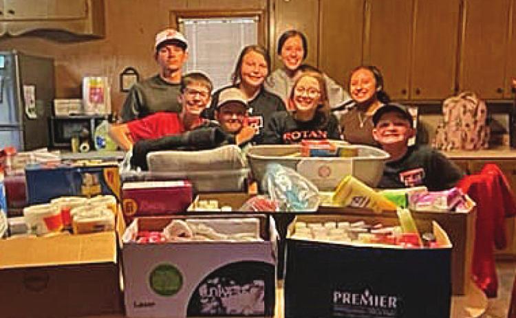 Pictured l to r: Rotan ISD students: Reese and Eli Weatherly, Gideon Preston, Chesney Fronterhouse, Kambrie Shelley, Avery Gonzalez, Chyanne Gaspar and Tucker McWilliams collect and load up supplies for Rotan ISD's IT Director Randy Hodges to take to Eastland.