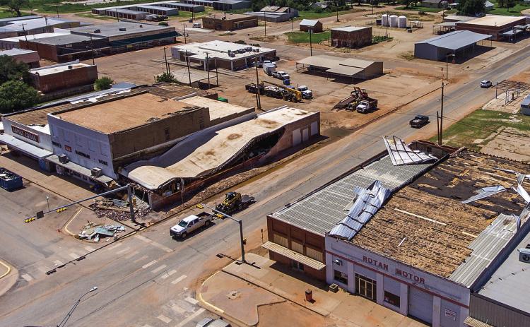 An aerial view shows the wide spread destruction to numerous downtown Rotan businesses, with significant roof damage visible to Rotan First National Bank, White's Hardware, Family Dollar and Rotan Motor. Not pictured is Angel Care which also suffered significant roof damage. (PHOTO BY DILLAN CULLIFER OF LUMINANCE STUDIOS)