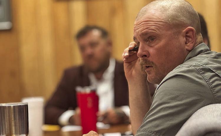 Aspermont City Council Member Cody Myers listens as city administrator Lorenzo Calamaco explains the request to access the city’s wastewater treatment plant from Wilda Beast LLC and his recommendation of a fee that would generate roughly $4,200 in revenue. PHOTO BY JEFF HURT