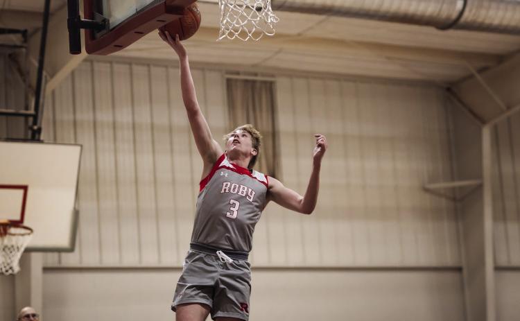 Roby senior Caiden Guy goes up for an easy layup during the Senior Caiden Guy also set a record for most points scored in a single game, putting up 55 of Roby's 91 points. PHOTO BY: MARK MARTINEZ