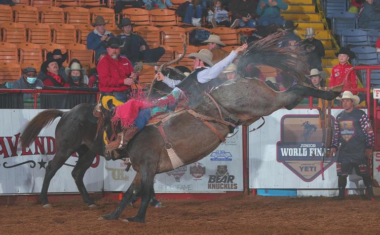 TW Flowers, riding, Duckworth, during the first day of Junior Roughstock World Finals at the Junior World Finals. Photo By: Bull Stock Media