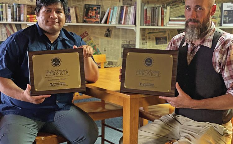 DMC Photographer Mark Martinez and editor, Jeff Hurt hold first place awards in Sports Photography and Editoral writing awarded duirng this year's Texas Press Association's Better Newspaper Contest.