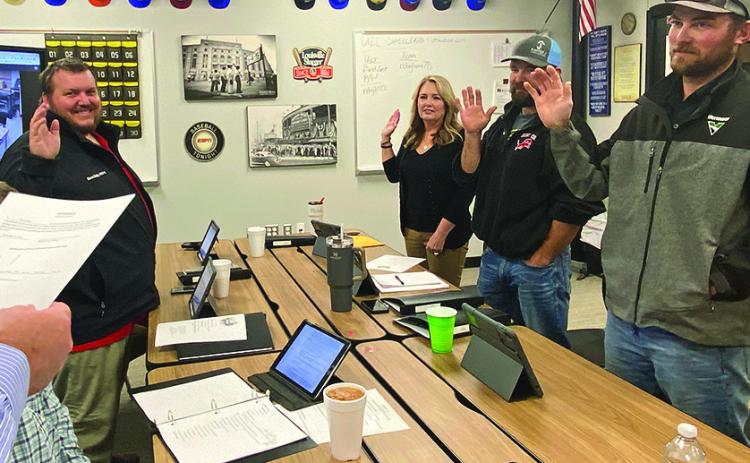 Roby CISD Superintendent Jason Carter sworn in new board member Michele Terry and returning board members, Kevin Kelley, and Dakota and Stormy Rasberry during Monday night's regular board meeting