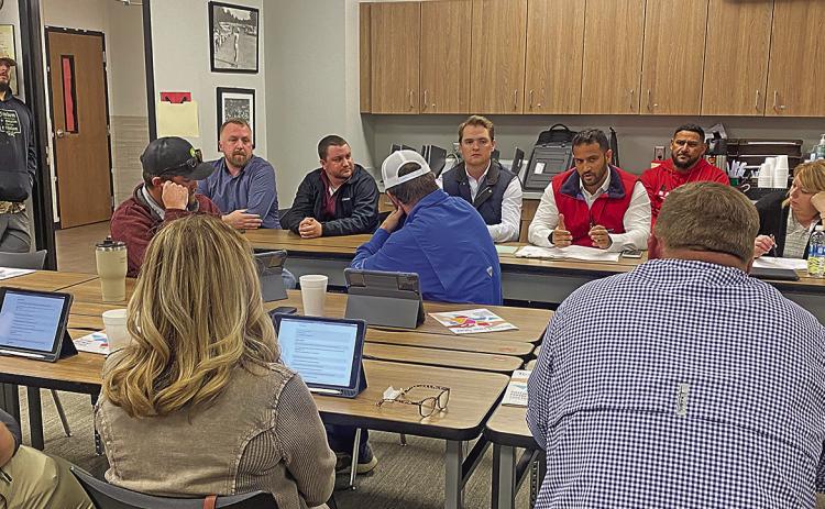 Representatives from WRA Architects and Gallagher Construction discuss with Roby CISD Trustees remaining troubled areas as the district's construction project nears completion.