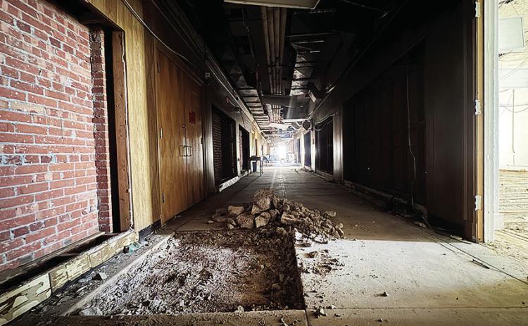 Exposed brickwork and chipped out concrete mark the early demolition phase inside Aspermont ISD’s junior high building, part of the district’s ongoing bond project to modernize facilities. Crews are nearing completion of the teardown before reconstruction begins in early 2026. JEFF HURT