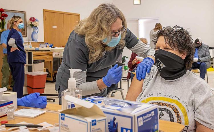SMHD Clinic Coordinator Jan Harris administers the COVID vaccine to Jayton resident Lenora Stanaland during the vaccine clinic held at the Kent County Community Center on Tuesday, February 9, 2021