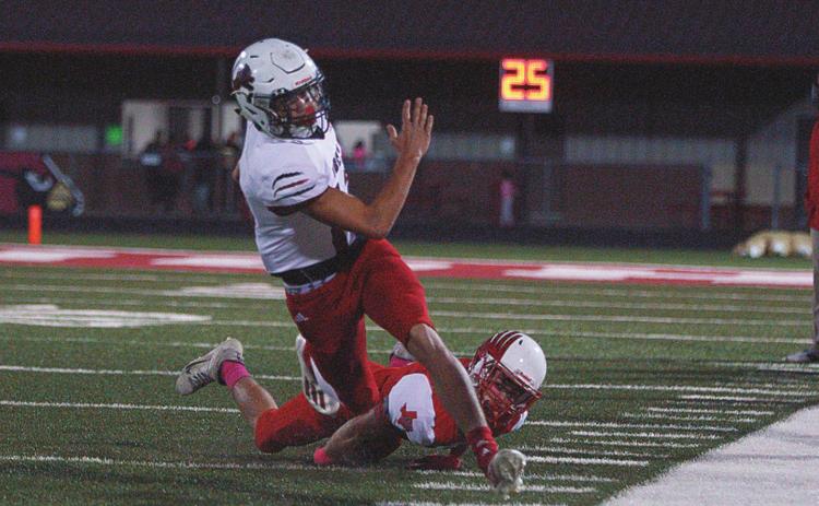 Senior, Gunner Helm maneuvers around a Hermleigh defender during his run towards the in zone.