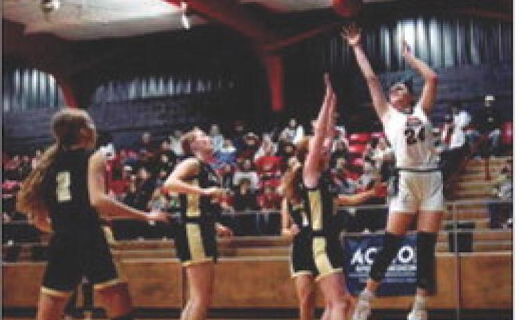 Above: Sophomore Keslie Criswell puts up a shot over Lady Jay defenders during the Aspermont Lady Hornets 46-34 win over Jayton just before Christmas break.
