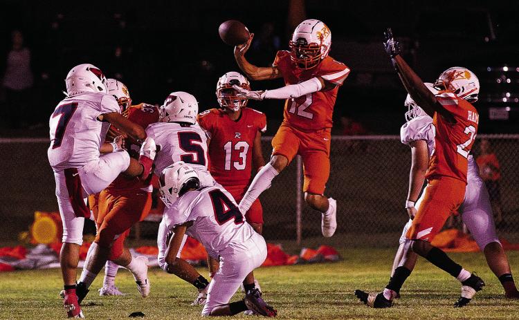 Rotan Freshman Jose Garza blocks Strawn's attempt for an extra point during Friday nights high scoring battle. The game, according to game announcer, was the 36th longest 6 man football game in Texas history. (Photo by Tricia Hurt)