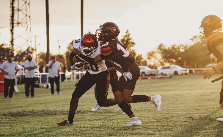 Freshman Isaiah Johson fights towrads the endzone while dragging an Eagle defender during the Aspermont Hornets narrow 47-48 loss to Southland last Friday night. The Hornets are now 1-1 going into week 3 and will take on Spur next in Spur this Friday night at 7:30pm. Photo by: Mark Martinez