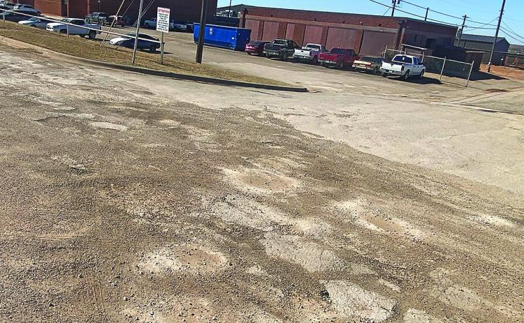Potholes along Florence Avenue are temporarily mended until supply chains improve.