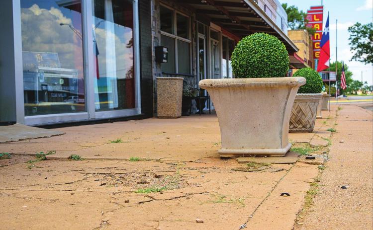 The City of Rotan is looking to replace the sidewalk on this, and three other downtown blocks. The remaining blocks, including the one in front of the Lance Theater will be considered in future grant cycles.