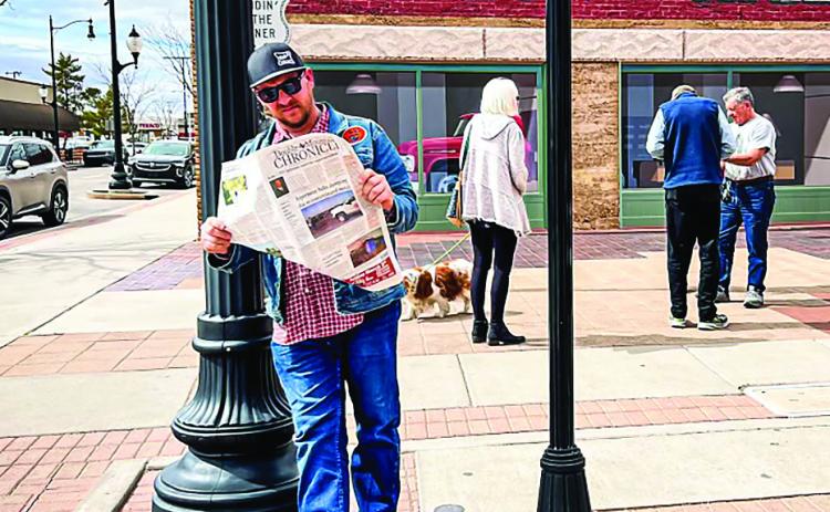 The Nomadic Newspaper is standing on the corner in Winslow Arizona