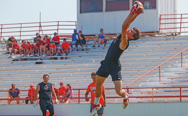 Pigs don't fly when Lions Leap: Roby Senior Gunner Helm makes a leaping grab to score in this past weekend's 6-on-6 Football Tournament hosted by the Rotan Athletic Booster Club. (Photo by Mark Martinez) More photos and results on Page 9