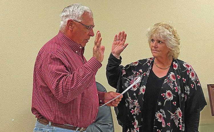 SMHD Board of Directors President Steve Teichelman swears in Ellen Abernathy as the board's newest member during last week's special-called meeting. Abernathy was a loan candidate on the ballot to replace Bill Hill, who announced he would not seek re-election this year after serving on the district's board for 12 years.
