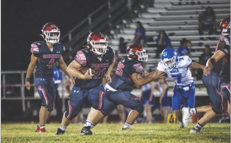 Aspermont Sophomore Tyler Kessinger recieves the hand off from teammate Caleb Broshears during the Hornets' 62-12 win over Rule last Friday night. PHOTO BY MARK MARTINEZ