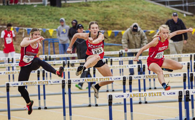 Aspermont's Mylee Van Meter (left), Rotan's Becca Kincheloe (middle), and Roby's Brylie Duniven (right) battle in the Girls 100 Meter Hurdle finals. Duniven would claim the Bronze in the event. PHOTO BY MARK MARTINEZ