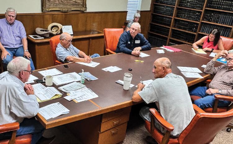 Stonewall County officials briefly share information in late September about the state’s review on data centers, which caused the county’s tax abatement hearing to be significantly delayed.