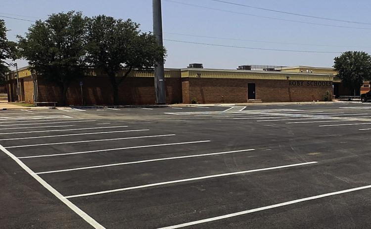 Roby CISD rolled out a new parking lot over the weekend. Although an expansion of the district's 2020 bond project, once workers had the necessary material, it took only days to remove old asphalt and replace it with new pavement and freshly painted stripes.