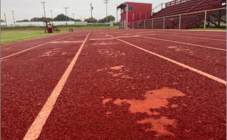Experts say frigid December temperatures during installation is the likely culprit for deteriorating Roby CISD track after only three years. The repairs and two new layers of material Hellas Sports will install in July is expected to extend the track’s lifespan by years. PHOTO BY MARK MARTINEZ