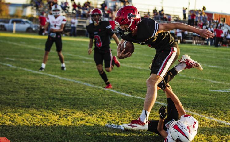 Roby Junior Kullen Daniel slips through a Bear defender to walk into the endzone during the Lions' 58-12 win over Baird last Friday night. With the win, the Lion's improve to 4-1 on the season, while in the process avenging their 0-64 loss to the Bears last season. The Lions will have a bye week this week before commencing district play next Friday night against the Ira Bulldogs in Roby. PHOTOS BY: MARK MARTINEZ
