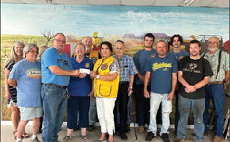 Members of the Rotan Volunteer Fire Dept. recieve a donation check in the amount of $500 from Plainview Lions via Fisher COunty Lions Club
