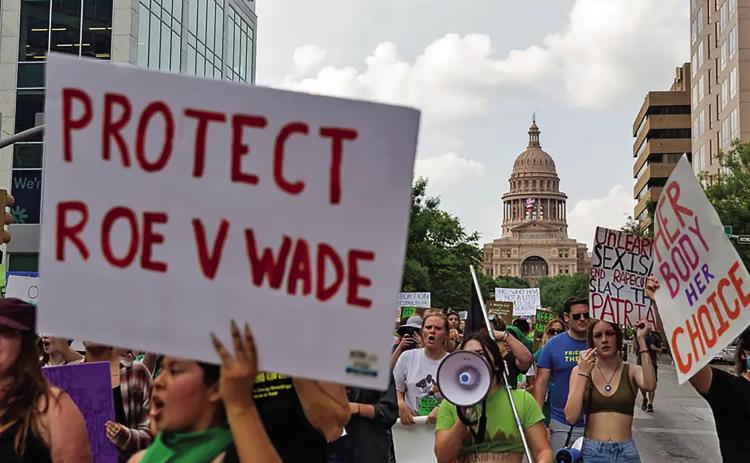 People rallying for abortion rights march down Congress Avenue in Austin on May 3, 2022. Credit: Lauren Witte/The Texas Tribune