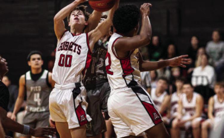 Aspermont's Graden Rabel comes down with a tough rebound during the Hornets 30-34 loss to Hamlin last Friday night. PHOTO BY: MARK MARTINEZ