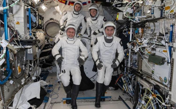 Four SpaceX Crew-11 members gather together for a crew portrait wearing their Dragon pressure suits during a suit verification check inside the International Space Station’s Kibo laboratory module. Clockwise from bottom left are, NASA astronaut Mike Fincke, Roscosmos cosmonaut Oleg Platonov, NASA astronaut Zena Cardman, and JAXA (Japan Aerospace Exploration Agency) astronaut Kimiya Yui. Credit: NASA