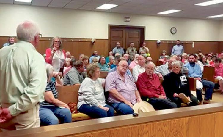 County officials, legal counsel, and company representatives share information and listen to public concerns during a public hearing held in April regarding Crusoe’s application for a reinvestment zone. PHOTO BY TRICIA HURT