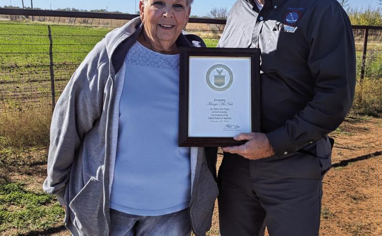 Justin Weaver, presented the award to Margie while visiting her homestead on a Tuesday morning (November 19, 2024).