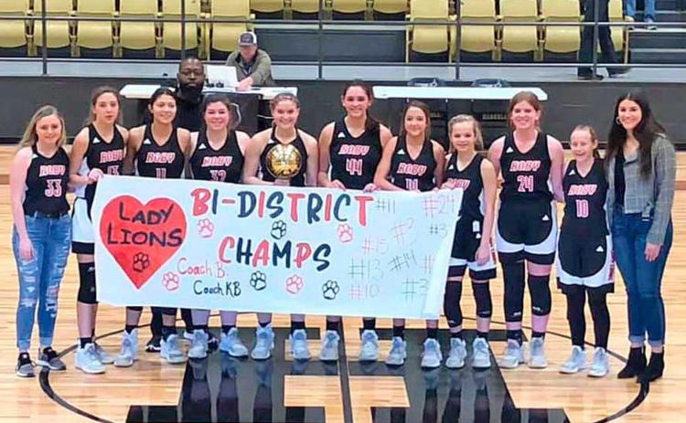 Lady Lions are Bi-District Champs! Emily Green, Hope Garmer, Hilda Espinoza, (in the back) Coach Kevin Brooks, Emilea Cole, Brynlie Johnson, Makenzie Castillo, Hailee Garmer, Chasity Benson, Laney Steart, Zena Hargrove and Coach Baylor Ramirez.