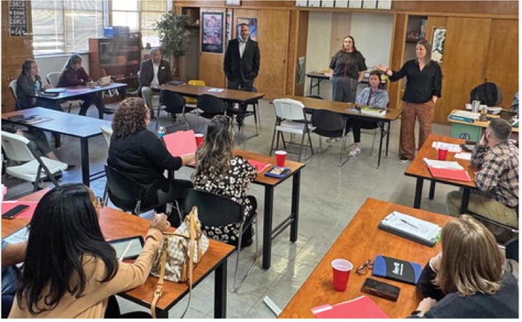 Aspermont ISD superintendent Zach Morris looks on while principal Tiffany Potts presents campus administrators from throughout Region 12 with innovative concepts for improving educational pathways as part of an administrative training camp the district hosted earlier this week.
