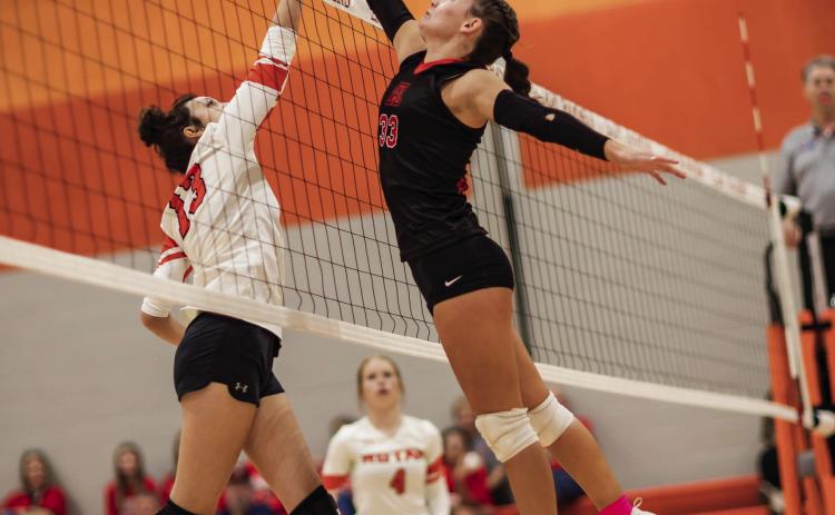 Aspermont's Addi Shugart (right) meets Rotan's Karlie Buchanan (left) at the top of the net during tuesday night's district matchup between the Lady Hornets and Lady Hammers. Aspermont would sweep Rotan in three hard fought games that came down to the wire. Photo by Mark Martinez