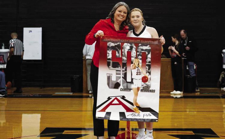 Aspermont Lady Hornet senior Matti Polk poses with Lady Hornet basketball head coach Tiffany Potts during a pregame celebration of Polk's career milestone 500 rebounds last Friday night in Aspermont. Photo by: Mark Martinez