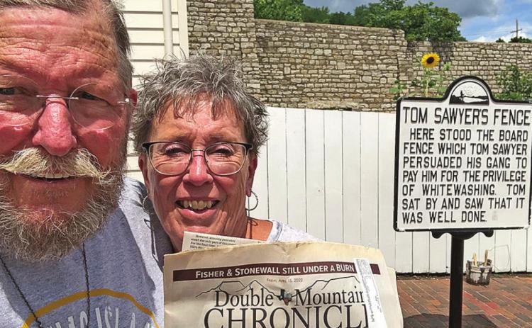 The Nomadic Newspaper says paintin' fences is fun!