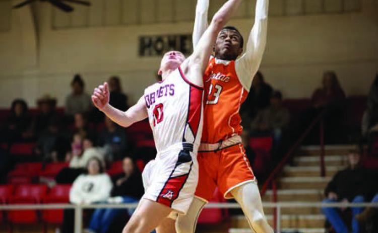 Rotan senior Jordan Daniel battles with Aspermont's Jasper Hope for a rebound during the Hammers' 50-78 loss the Hornets last Tuesday night. Photo by Tricia Hurt