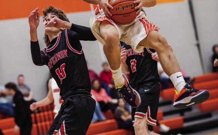 Rotan's Caleb Fortushniak goes airborne for a shot over a Hornet defender during the JV Hammers 24-19 win over Aspermont late last month. Photo by Mark Martinez