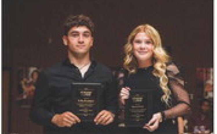 Seniors Kolby Bradshaw &amp; Matti Polk recieving the A.I.S.D. Student of the Year Award.
