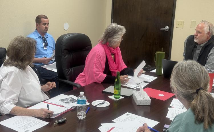 SMHD Board of Directors review district finances before approving a resolution to authorize funds to cover 2020 construction debt.