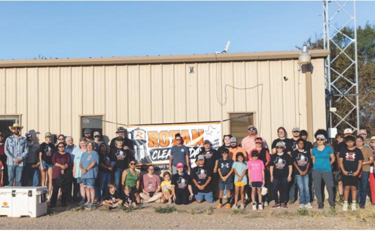 A small group of volunteers gathers early Saturday morning before heading out to their assignments during Rotan's first community-wide cleanup day. More than 140 volunteers ultimately participated in the effort, tackling projects across town and helping remove approximately 300 cubic yards of debris. PHOTO BY MARK MARTINEZ