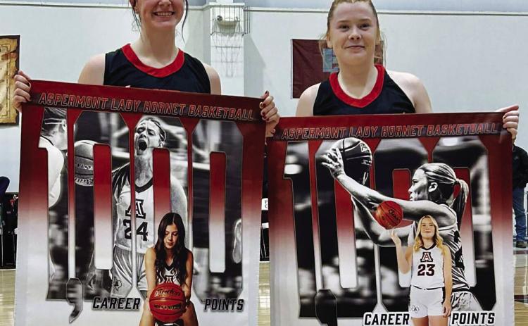 Lady Hornets Keslie Criswell &amp; Matti Polk pose together after they both acheived 1000 career points during their 74-17 win over Paint Creek last Tuesday. Courtesy Photo