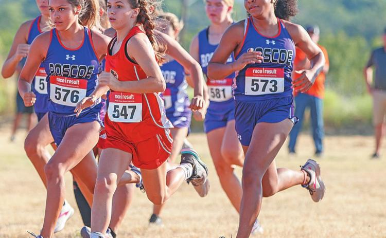Freshman Lilly Benson begins to set her pace in the Girls' run. Photo by: Mark Martinez