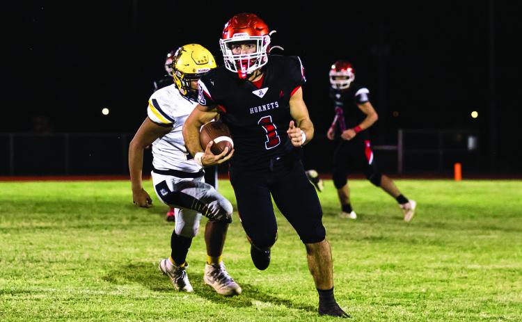 Aspermont's Kolby Bradshaw breaks free for long run towards the endzone during the Hornets 44-64 loss to Loraine last Friday night. The Hornets move to 2-3 on the season and will take on the Rotan Yellowhammers this Friday in Rotan at 7pm in their last match before district play. Photo by: Mark Martinez