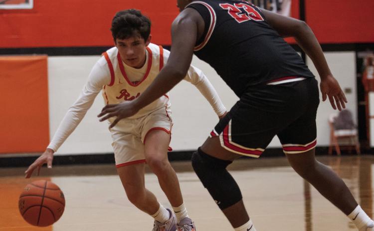 Rotan's Kaeden Krebsbach fights to get around Aspermont's Donovan Miller during the Hammers 25-63 loss to the Hornets last Friday night. (PHOTOS BY MARK MARTINEZ)