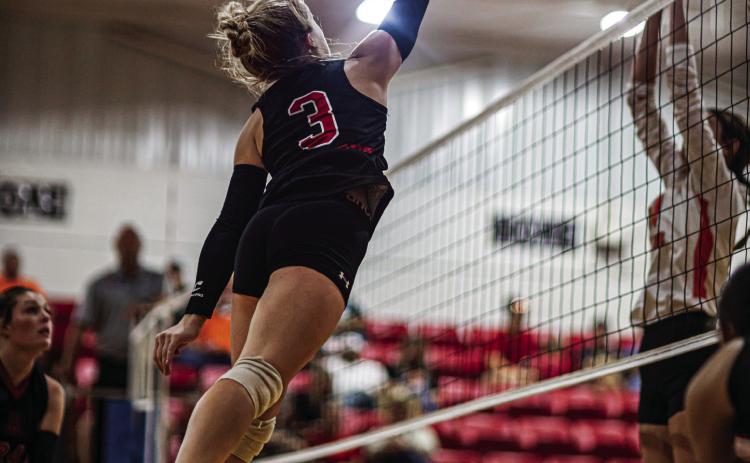 Lady Hornet Junior Mylee Van Meter fires a kill over Lady Dragon defenders during Aspermont's 3-0 win over Paducah this past Saturday. PHOTO BY MARK MARTINEZ
