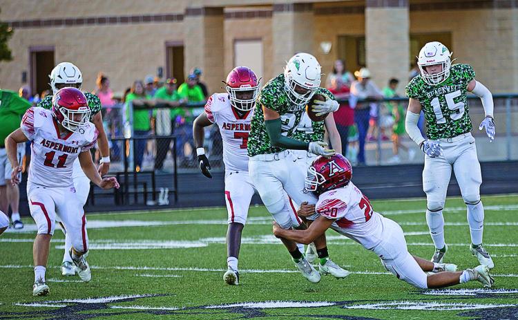 Aspermont's Carson  Guidry wraps up the opposing Hornet ball carrier in last Friday's 34-28 win over Blackwell.